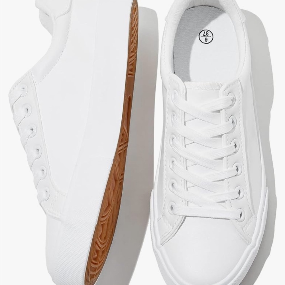 Brand new. Never worn. Womens white tennis shoes.